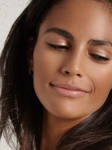 Lady smiling showing of eyebrows